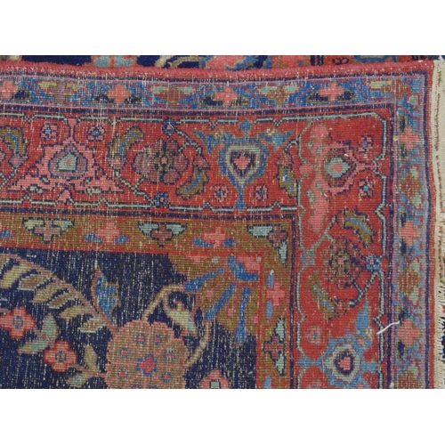 439 - Blue ground red, olive green, pink and pale blue patterned rug (end tassels af) - 1.24m x 2.6m