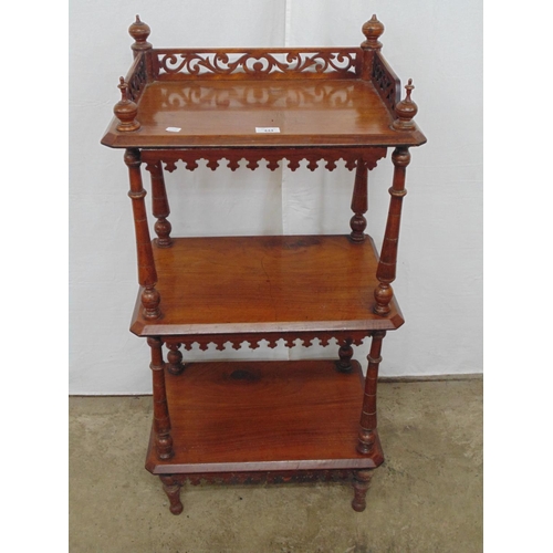 444 - Mahogany three tier rectangular what-not with pierced gallery having four finials, the turned column... 