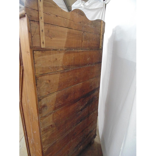 446 - Rustic pine cupboard with raised back having two opening and one sliding door over fall front above ... 