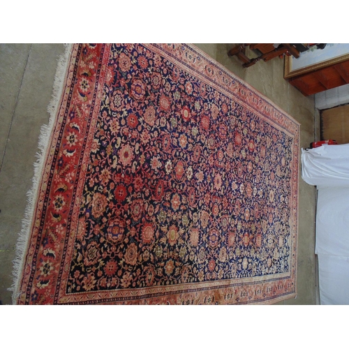 449 - Blue ground rug with red, gold and pink pattern, tassels one end (sun bleached in places) - 4.22m x ... 