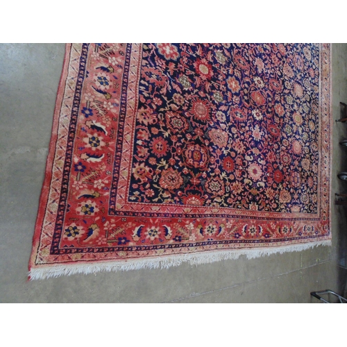 449 - Blue ground rug with red, gold and pink pattern, tassels one end (sun bleached in places) - 4.22m x ... 