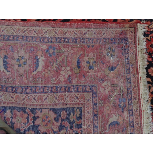 449 - Blue ground rug with red, gold and pink pattern, tassels one end (sun bleached in places) - 4.22m x ... 