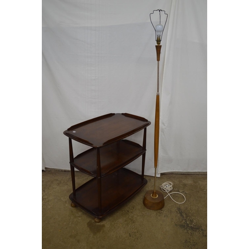 457 - Dark Ercol three tier tea/serving trolley each tier having a raised gallery and standing on castors ... 