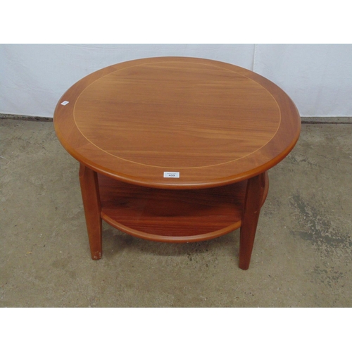 459 - Legate teak inlaid circular two tier coffee table standing on tapering legs