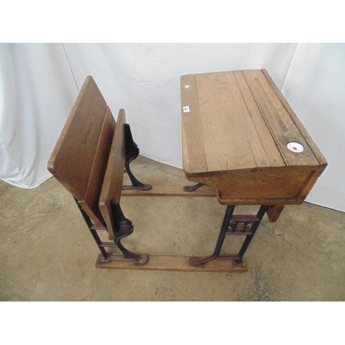 468 - Wooden solid top school desk with ceramic ink well liner and pen recess over open shelf, standing on... 