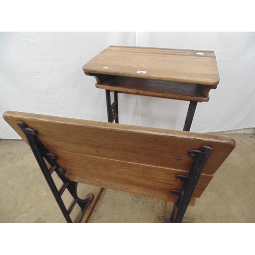 468 - Wooden solid top school desk with ceramic ink well liner and pen recess over open shelf, standing on... 