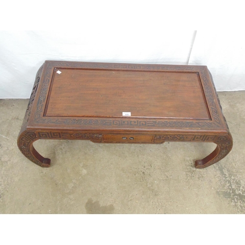 470 - Hardwood Oriental style coffee table with carved border, frieze and legs having central drawer and c... 