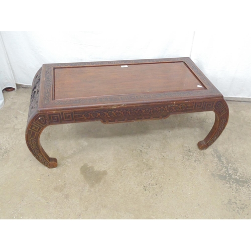 470 - Hardwood Oriental style coffee table with carved border, frieze and legs having central drawer and c... 