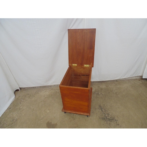 475 - Cedarwood box having hinged lid opening to storage space, standing on castors - 55cm x 39cm x 55cm t... 