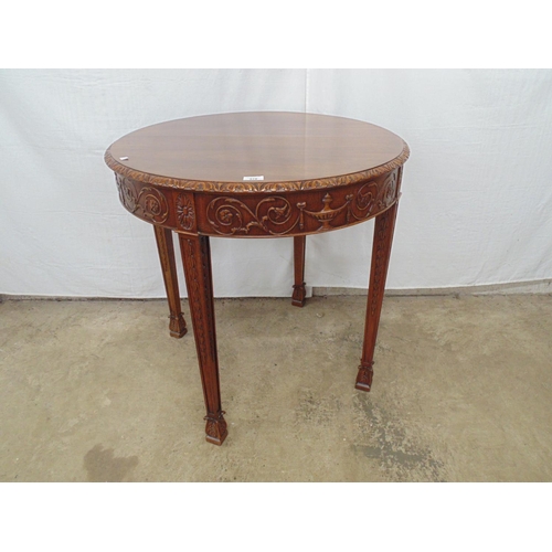 478 - Mahogany centre table having carved edge, frieze and tapering legs ending in stylised flower feet - ... 