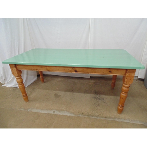 481 - Pine kitchen/dining table having painted green top, standing on turned tapering legs - 180cm x 83cm ... 