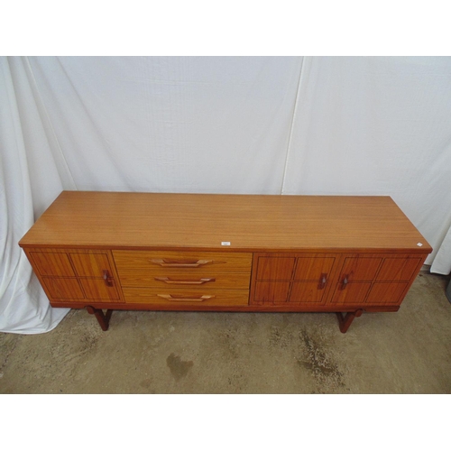 482 - Mid century teak sideboard having black incised linear squares to doors, the two right hand doors op... 