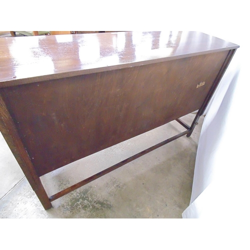 493 - Oak sideboard having three drawers (one baize lined) over three panelled cupboard doors, standing on... 