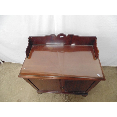 501 - Mahogany cupboard with raised back and two doors opening to reveal single shelf, removable glass top... 