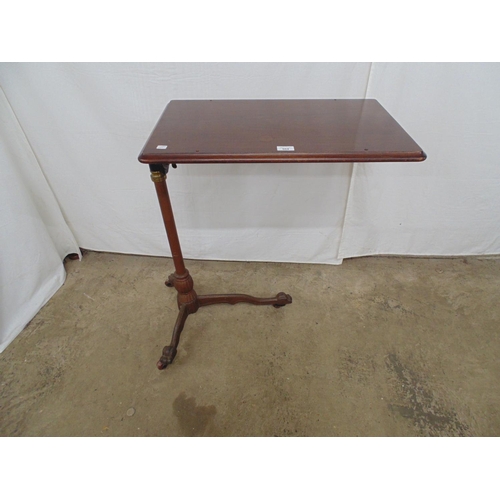 504 - 20th century bed table/trolley having mahogany tilt top, standing on iron column leading to three le... 