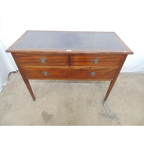 519 - Inlaid mahogany writing desk having green leather gilt tooled inset top over two short and one long ... 