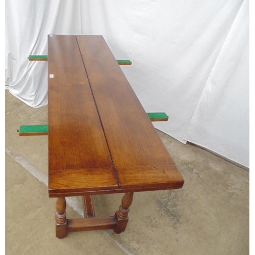 528 - 20th century oak fold over dining table having a three piece hinged top opening onto pull out suppor... 