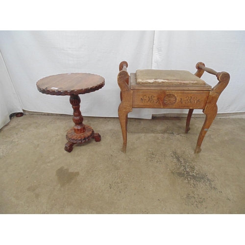 550 - Circular pine occasional table the carved top over a carved column leading to a platform base with c... 