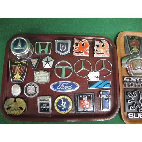 14 - Two trays of metal and plastic vehicle manufacturers badges to include: Ford, Avenger, Golf GTI, Sub... 