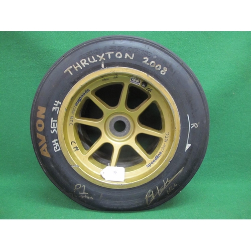 39 - Used racing car wheel and tyre (Avon 250/57 OR13) marked in white for Thruxton 2008 and signed - 22