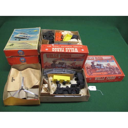 495 - Three tinplate helicopters having hand powered flight possibilities with instructions from Arnold (W... 