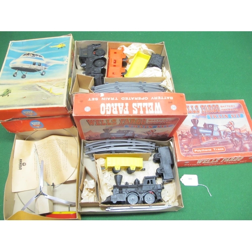 495 - Three tinplate helicopters having hand powered flight possibilities with instructions from Arnold (W... 