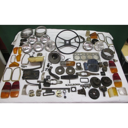 62 - Large quantity of parts from a Volvo 144 to include: head gasket, lamps, badges, lenses, steering wh... 