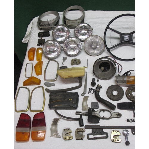 62 - Large quantity of parts from a Volvo 144 to include: head gasket, lamps, badges, lenses, steering wh... 