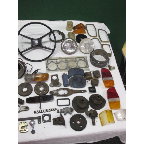 62 - Large quantity of parts from a Volvo 144 to include: head gasket, lamps, badges, lenses, steering wh... 