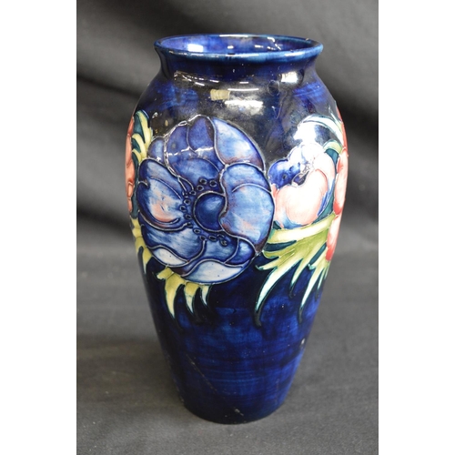 123 - Moorcroft pottery vase in the Anemone pattern on blue ground, signed on base and retaining circular ... 