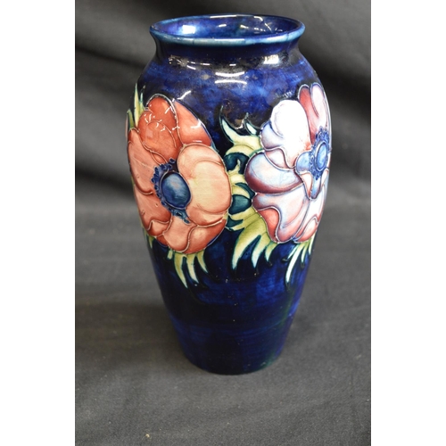 123 - Moorcroft pottery vase in the Anemone pattern on blue ground, signed on base and retaining circular ... 