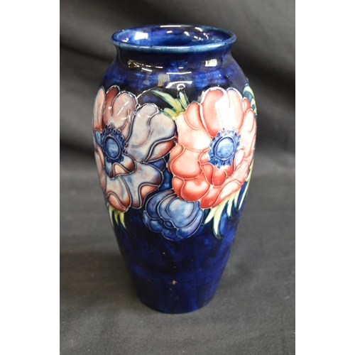 123 - Moorcroft pottery vase in the Anemone pattern on blue ground, signed on base and retaining circular ... 