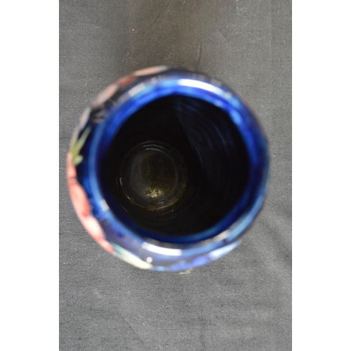 123 - Moorcroft pottery vase in the Anemone pattern on blue ground, signed on base and retaining circular ... 