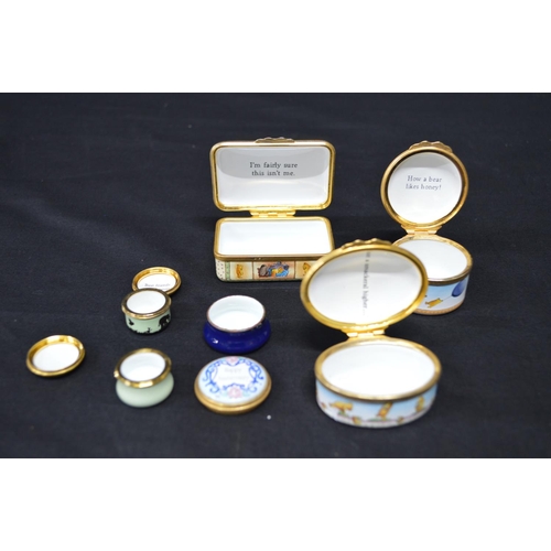 127 - Group of five Halcyon Days enamel trinket boxes (four Winnie the Pooh and floral decorated) together... 