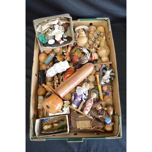182 - Two boxes containing a quantity of Kokeshi and other dolls