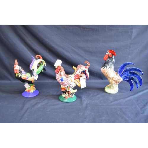 190 - Two Sharon Neuhaus Poultry In Motion figures of cockerels together with three other cockerel figures... 