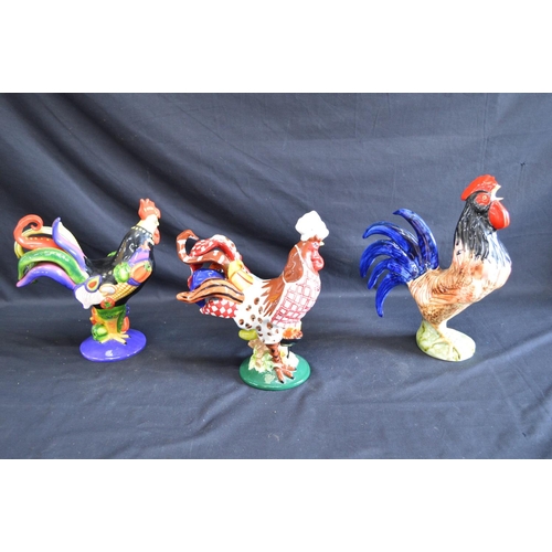 190 - Two Sharon Neuhaus Poultry In Motion figures of cockerels together with three other cockerel figures... 