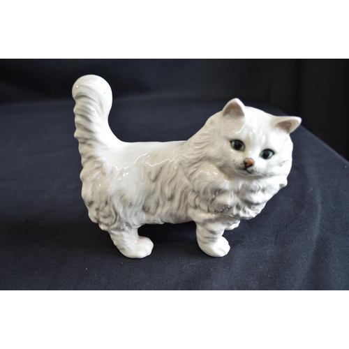 196 - Beswick figure of a white cat together with an Algora figure of a dog, two wooden gazelle and a gree... 