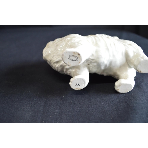 196 - Beswick figure of a white cat together with an Algora figure of a dog, two wooden gazelle and a gree... 