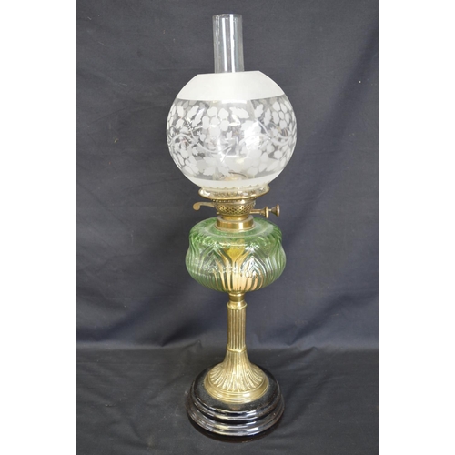 237 - Victorian oil lamp having green glass reservoir supported on brass reeded column and having globular... 