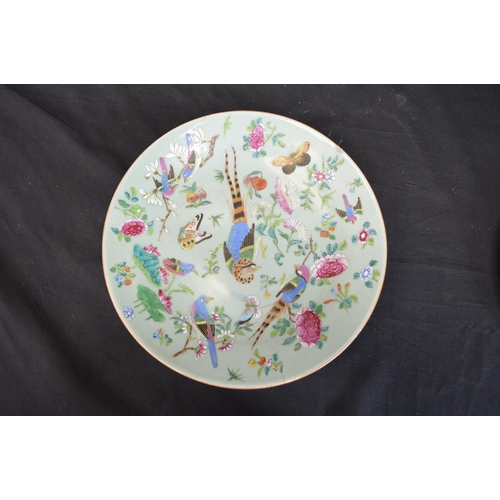 48 - Celadon green hand painted plate having decoration of birds, flowers and butterflies with blue squar... 