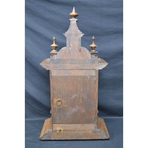 63 - Walnut cased mantle clock of architectural style having brass face with silvered chapter ring, black... 
