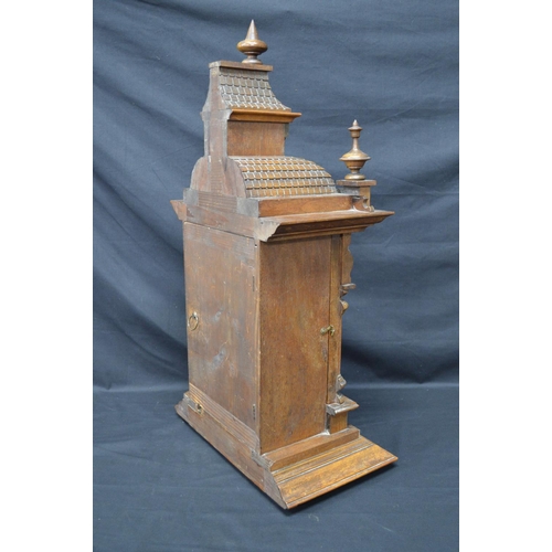 63 - Walnut cased mantle clock of architectural style having brass face with silvered chapter ring, black... 