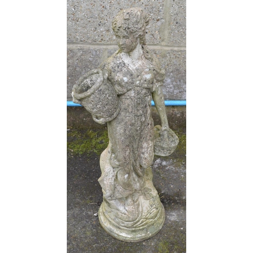 179 - Statue of a young lady holding baskets, standing on circular bases - 70cm tall