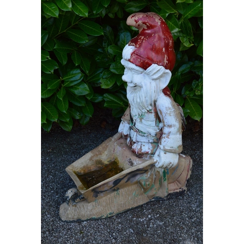 49 - Painted resin figural planter of a gnome pushing a wheelbarrow - 35cm x 76cm tall