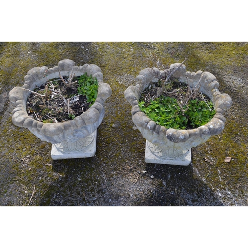 66 - Pair of leaf decorated garden urns - 50cm dia x 44cm tall