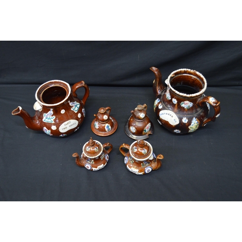 191 - Group of four Barge ware teapots the largest inscribed Remember Me - 31cm tall