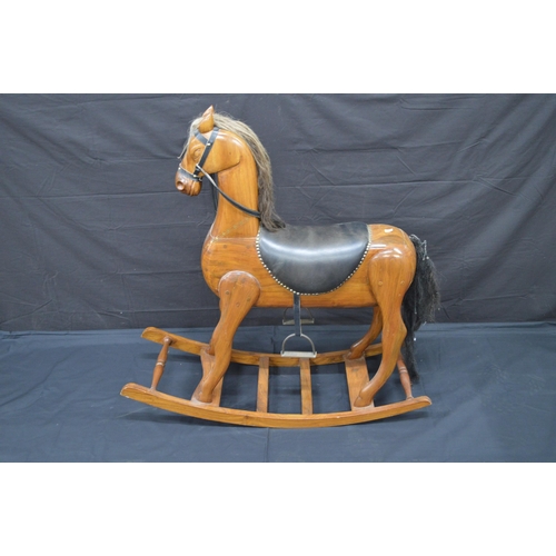 Hardwood rocking horse with brass inlay and padded saddle - 98cm tall