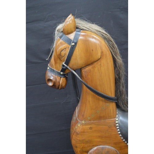 Hardwood rocking horse with brass inlay and padded saddle - 98cm tall