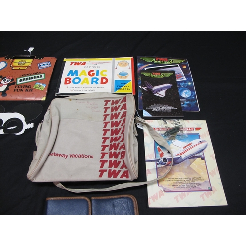 109 - Quantity of 1980's Pan Am items to comprise: three Flying Fun Kits, a mask, headphones and three pla... 